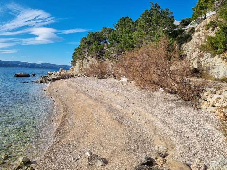 Rape beach western view with clear sea and pebble shore, Lokva Rogoznica