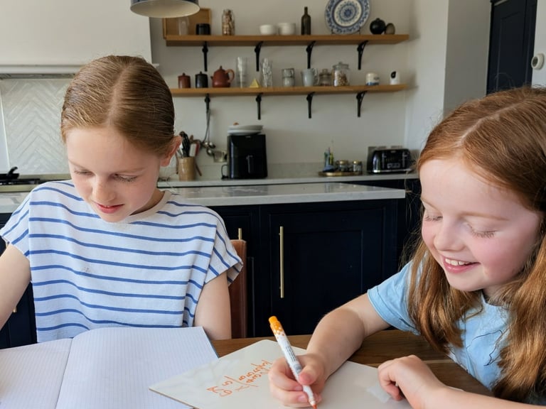 Two primary aged children are working together in a 11+tuition session in Kent UK