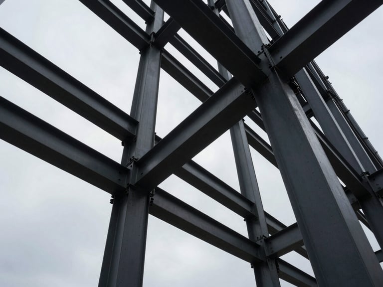 Extreme wide-angle shot of structural steel beams of a modern skyscraper under a cool overcast sky, high-contrast architectural shadows, geometric precision
