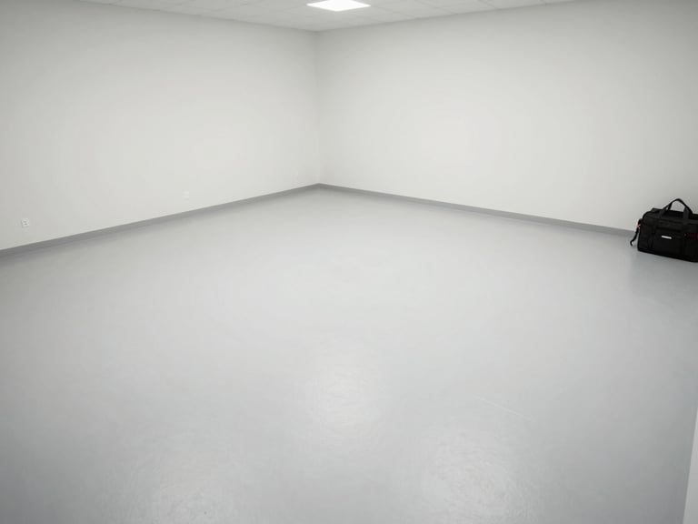 Wide environmental shot of a treated empty room, clean surfaces under clear daylight, a technician's equipment bag visible in the corner as evidence of completed work, overhead documentation angle
