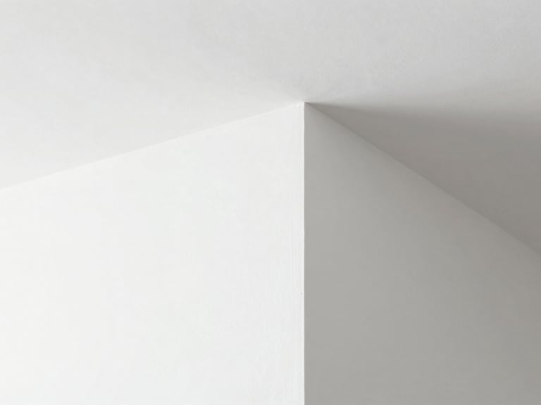 Architectural close-up of a perfectly smooth white Gyproc plaster joint, sharp corner bead, clean minimalist interior under bright natural light