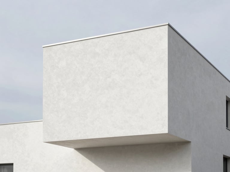Minimalist modern house exterior showing flawless white crépi taloché texture against a soft Belgian sky, sharp shadow lines