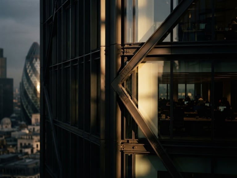 Moody architectural detail of a modern London corporate building, sharp geometric shadows, warm directional window light, 35mm film