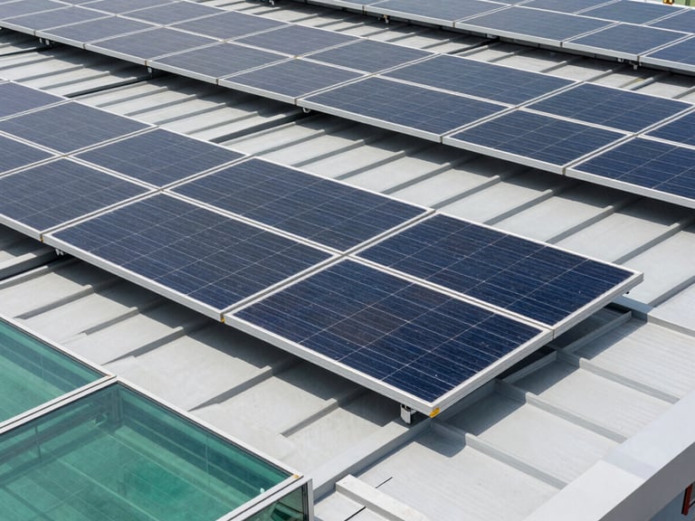 A close-up of premium monocrystalline solar cells integrated into a modern industrial roof, high-contrast daylight, clean glass surfaces, Hasselblad medium format