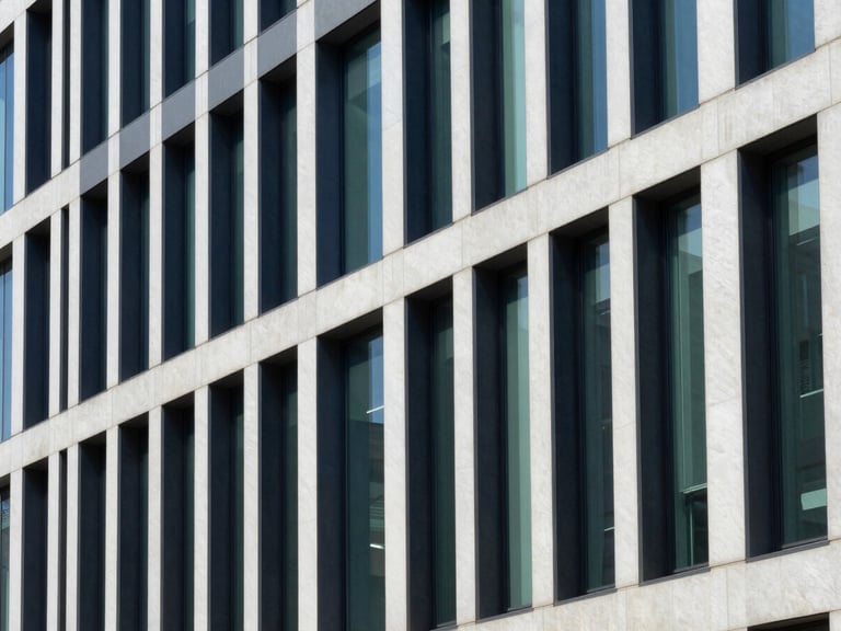 Architectural lines of a modern office building interior, focusing on structured pathways, crisp natural daylight, deep navy and emerald tones, sharp focus, 35mm