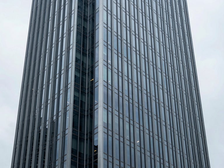 Architectural wide shot of a modern office tower facade in Brisbane, crisp overcast daylight, steel blue reflections, premium editorial style
