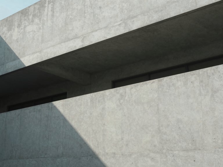 Minimalist architectural lines of a concrete building casting sharp geometric shadows under diffused daylight, 35mm photography