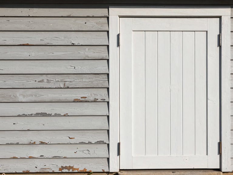 Side-by-side split of an exterior wood siding panel — left half showing weathered, chalking paint with peeling edges; right half showing the same surface freshly primed and painted, straight-on framing, flat north-facing daylight, no people