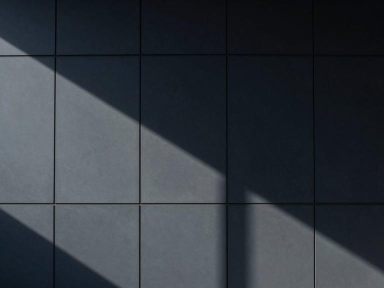 Abstract geometric shadows on a modern office wall, minimalist corporate photography, cool diffused daylight, deep navy and slate tones, architectural symmetry, 35mm lens