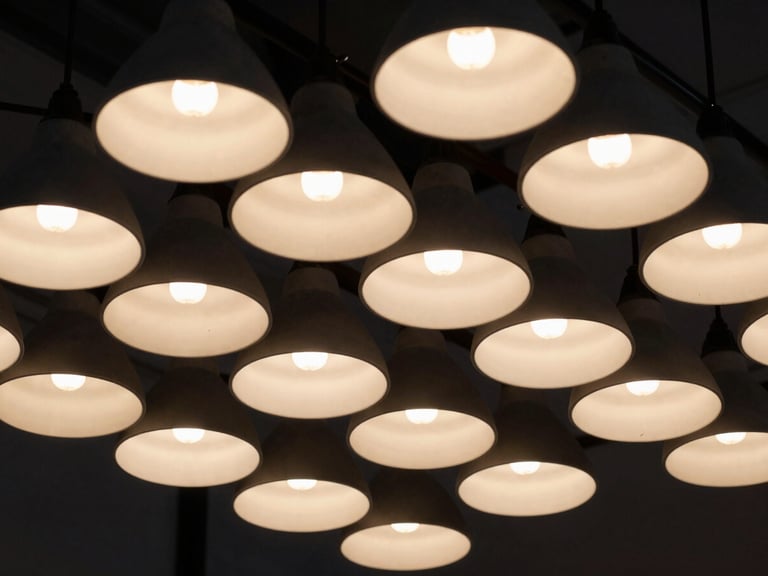 Detail shot of integrated lighting fixtures within an exhibition stand, casting dramatic shadows and warm glows, high-contrast, sharp focus, 35mm format