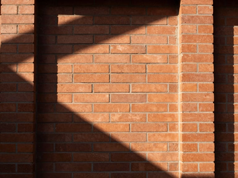 Tight graphic architectural close-up of a terracotta brick wall with natural high-contrast sunlight casting deep geometric shadows, 35mm