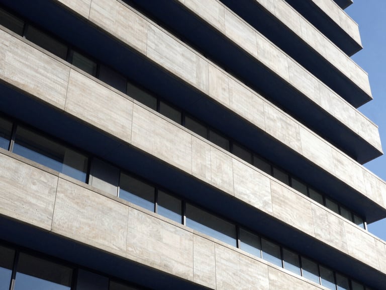 Abstract financial lines, architectural details, modern corporate setting, natural light, deep navy and neutral tones, sharp focus, 35mm