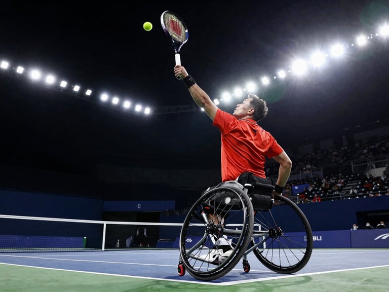 Low-angle dynamic action shot of a wheelchair tennis player mid-serve under intense stadium floodlights, racket frozen at peak extension, high contrast.
