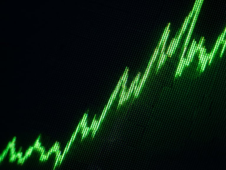 Macro screen detail of an iOS App Store chart showing rapid upward trajectory, neon green data lines on a deep obsidian background, high-contrast technical photography, 35mm.