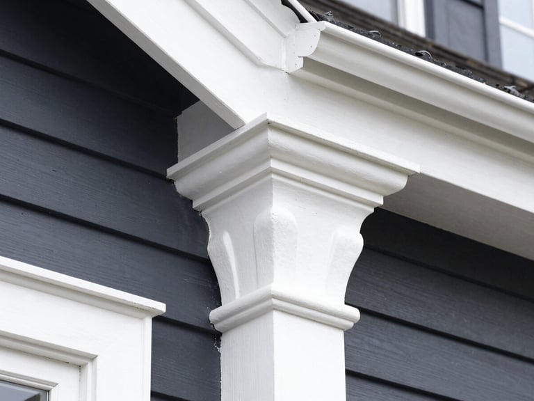 Crisp close-up of razor-sharp paint edges on white Victorian timber trim against deep charcoal weatherboards, bright natural daylight, sharp focus