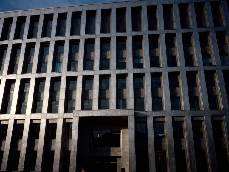 Cinematic wide shot of a modern monolithic government building facade at dusk, high-contrast chiaroscuro, 35mm
