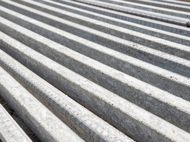 Close-up of concrete reinforcement steel bars on a construction site, geometric patterns, bright daylight