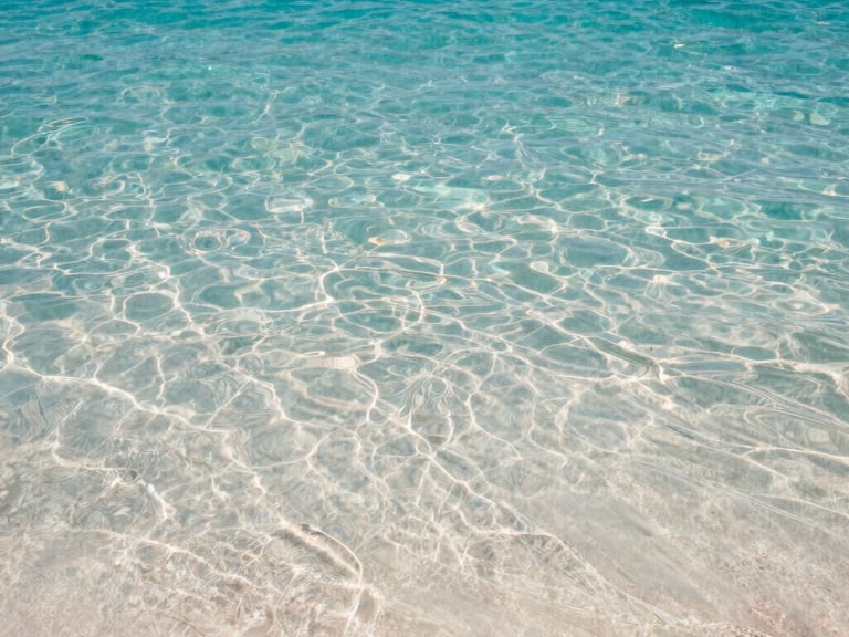 A clear-water seaside on Sithonia with Sail boat Christina