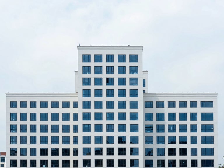 Abstract high-altitude urban planning, geometric compositions, bright overcast daylight, clean white and deep blue tones, sharp focus, 35mm