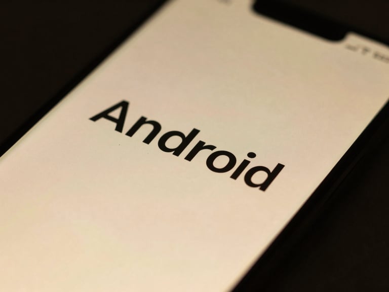 Macro close-up of a high-resolution Android screen displaying flawless typography and smooth transitional animations, soft gold ambient glow, dark background.