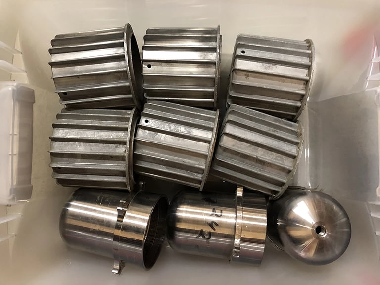 Metal parts in a sculptor's workshop bin, image 7.