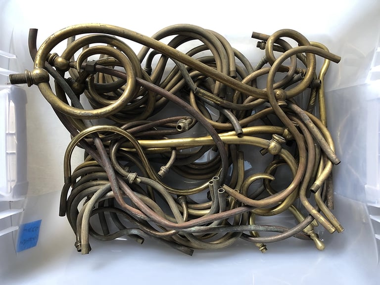 Metal parts in a sculptor's workshop bin, image 5.
