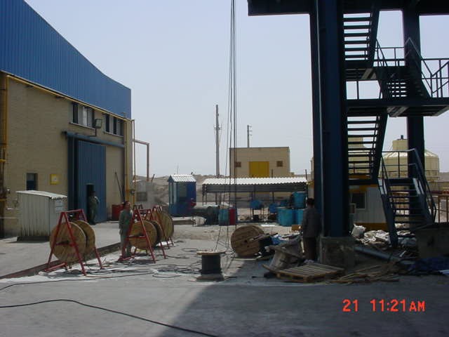 Industrial facility yard with cable reels to wire up equipment. 