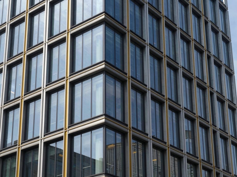 Sharp architectural photography, bright daylight, modern corporate building facade with glass and steel, clean lines, high-contrast, sora font vibe, 35mm
