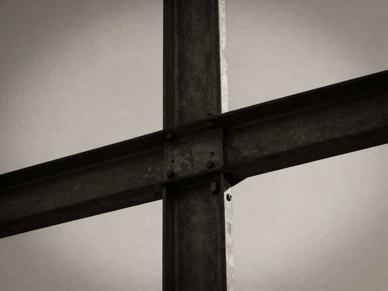 Monochrome close-up of structural steel joints intersecting, dramatic side-lighting, deep shadows, textured brush background, desaturated warm tones.