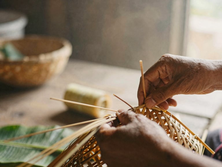 Close-up of skilled hands weaving a basket from natural banana tree fibers, warm morning light, rustic workshop background