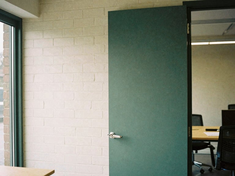 Architectural detail of a clean, modern brick workspace in the Midlands, soft overcast daylight, natural shadows, 35mm film grain