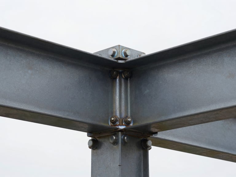 High-contrast close-up of a structural steel connection with heavy bolts and clean welds, industrial daylight highlighting the raw steel texture.