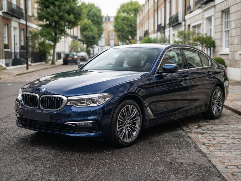 Three-quarter view of a clean, professionally detailed dark blue sedan parked on a quiet street in soft overcast daylight, sharp focus, professional editorial style, 50mm lens
