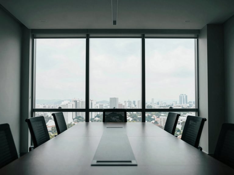 Wide environmental shot of a minimalist high-altitude corporate boardroom in São Paulo, cool natural window light, sharp architectural shadows, desaturated tones with deep green accents, 35mm