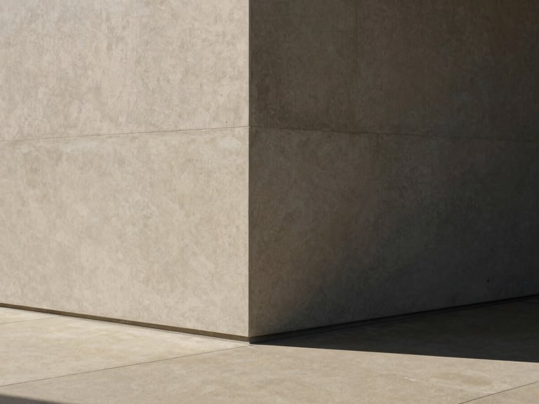 Minimalist architectural corner of a modern Australian office, soft natural daylight casting shadows on warm concrete, 35mm photography
