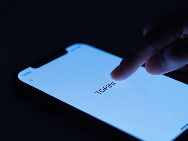 Close-up of a hand interacting with a smartphone screen, subtle haptic feedback animation on TORINI UI, low-key lighting, electric blue glow.