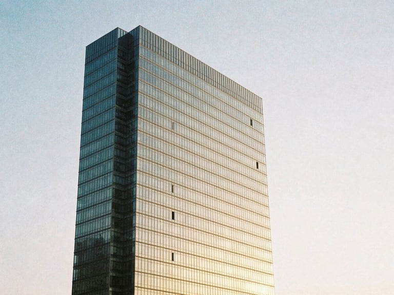 Wide architectural angle of high-end minimalist coastal skyscraper facade in Balneário Camboriú, soft golden hour sunlight reflecting off structured glass panels, medium format film