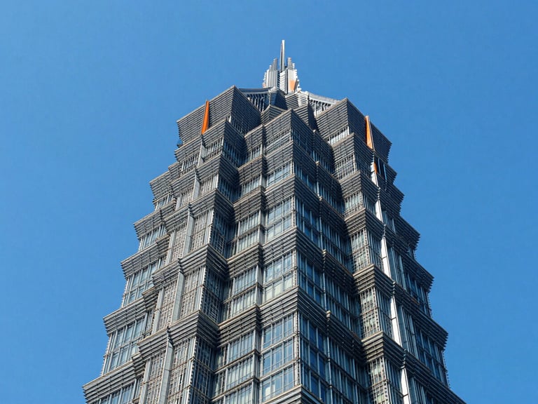 Abstract structural geometry of a modern steel skyscraper frame, looking straight up, bright blue sky, high-contrast lighting, sharp lines