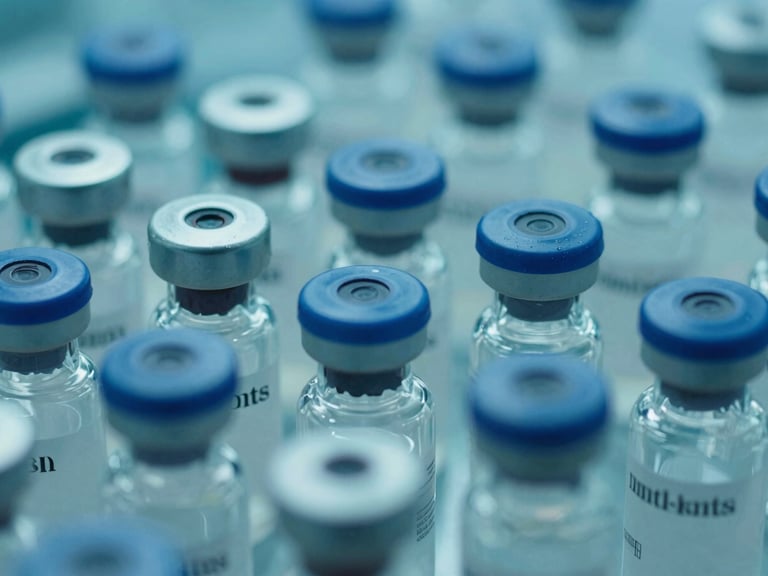 Close-up of lyophilized powder vials in a sterile cleanroom environment, teal and blue cinematic highlights