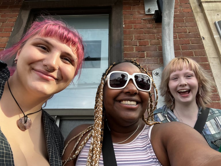 3 people taking a selfie 