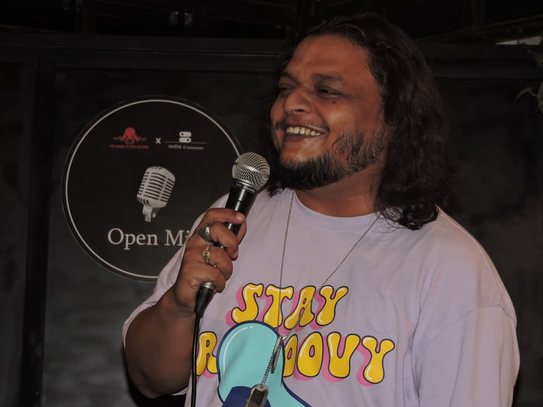 Sudhanshu Marwade, a stand up comedian, performs at an Orange Octopus event in 2024
