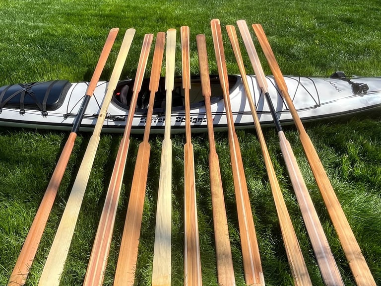 wooden greenland paddles on display