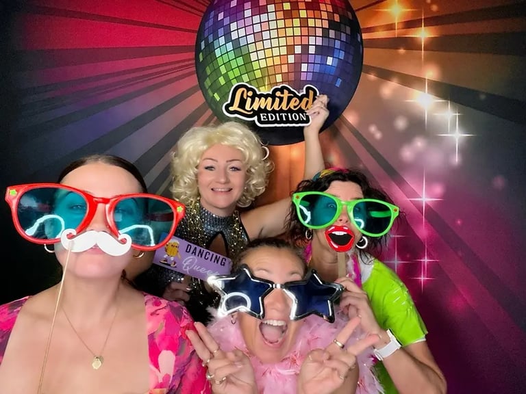 Guests in the open air photo booth with big glasses at Chrissy's MS fundraiser in Capalaba.