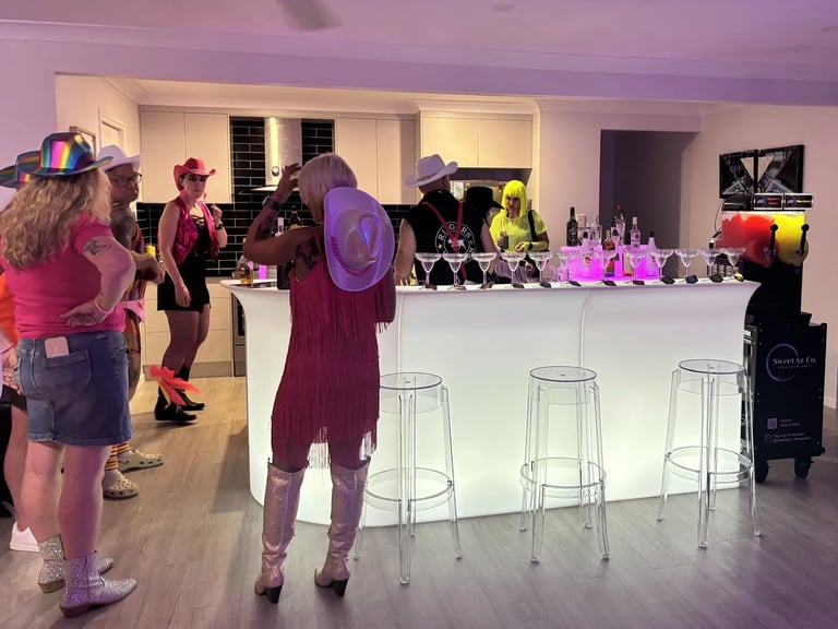 Glow Bar with guests mingling on arrival at a new Years party in Redlandbay, Redlands - party hire by SweetAz Co.