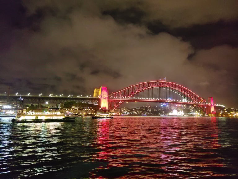 The Sydney Harbor Bridge in Australia lights up at night