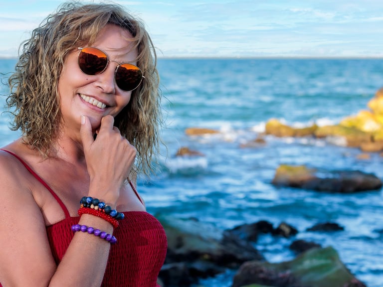 a woman in a red dress and sunglasses