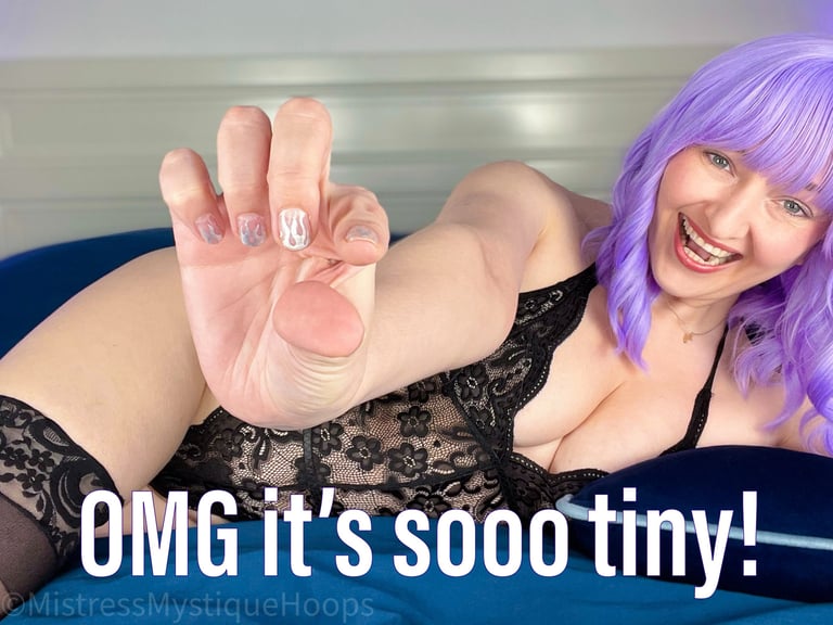 Femdom Mistress in black lingerie saying, "OMG it's so tiny" as small penis humiliation sph