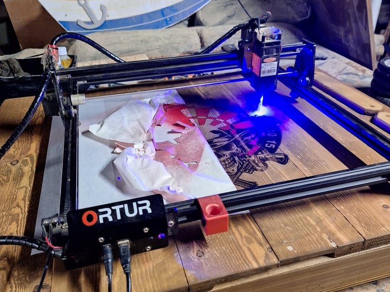 a laser printer engraving an image on to wood