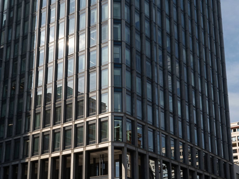 High-contrast architectural detail of modern Levent business district in Istanbul, sharp natural side-lighting cutting through glass windows, deep shadows, prestigious and decisive mood.