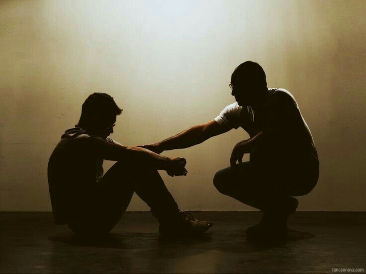 man talks with another